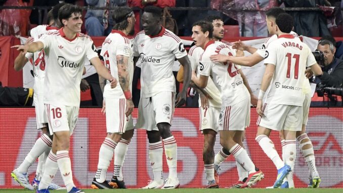 Adams Akor with Sevilla teammates