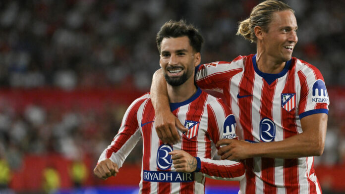 El Atlético vence al Sevilla y se coloca líder de La Liga El Atlético vence al Sevilla y se coloca líder de La Liga